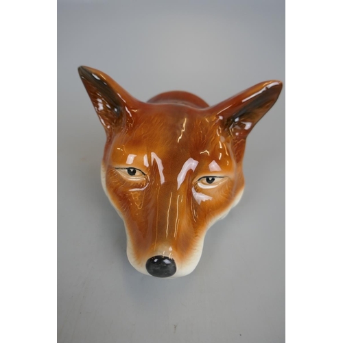 136 - Pair of fox and hound stirrup cups