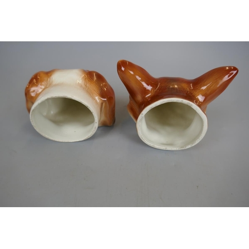 136 - Pair of fox and hound stirrup cups