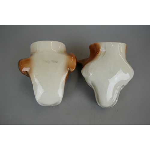 136 - Pair of fox and hound stirrup cups