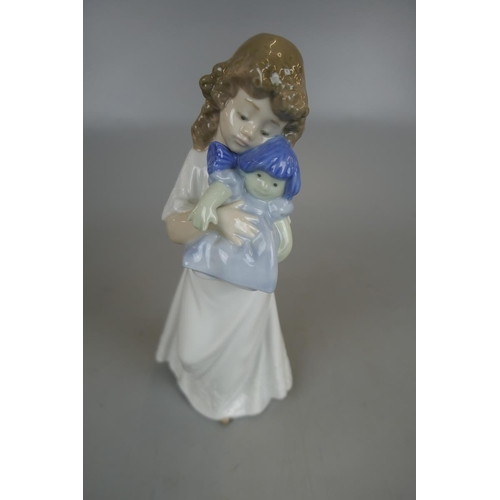 209 - 3 figurines to include a Royal Worcester Queen Elizabeth II and Lladro Nao