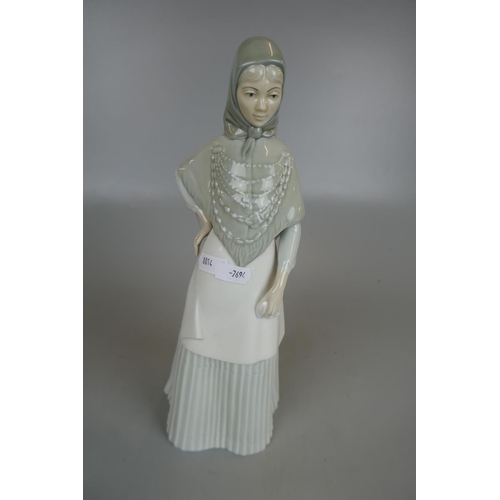 209 - 3 figurines to include a Royal Worcester Queen Elizabeth II and Lladro Nao