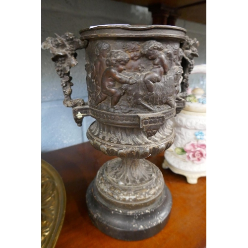 214 - Collectables to include a metal cherub vase