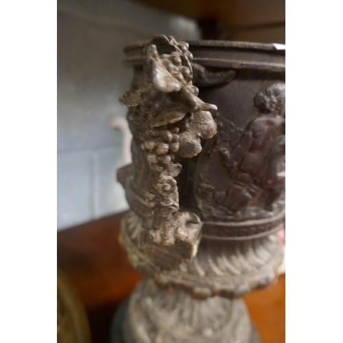 214 - Collectables to include a metal cherub vase