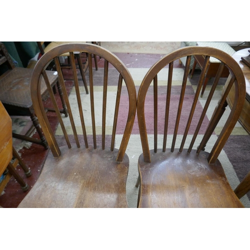 244 - Pair of Ercol stick-back dining chairs together with another