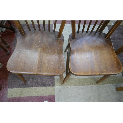 244 - Pair of Ercol stick-back dining chairs together with another