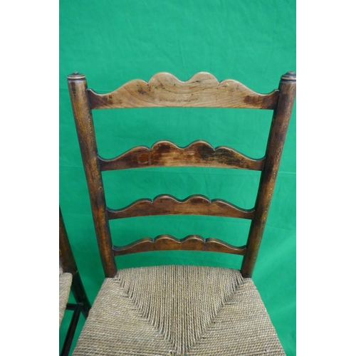 252 - Pair of ladder-back rush seated chairs