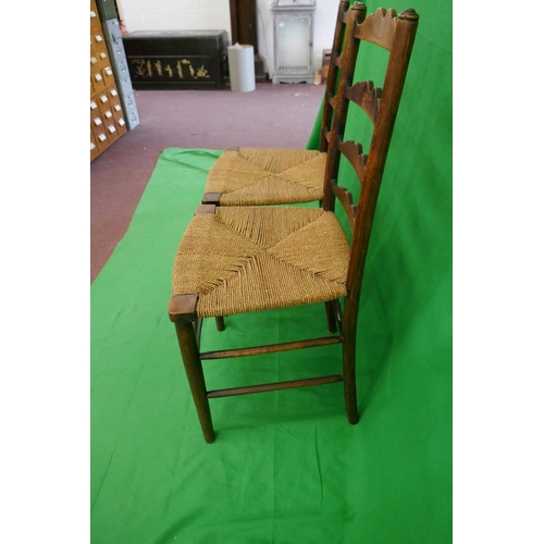 252 - Pair of ladder-back rush seated chairs