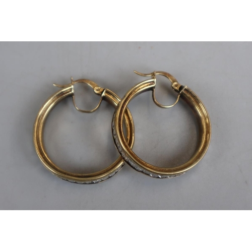 31 - Pair of gold earrings