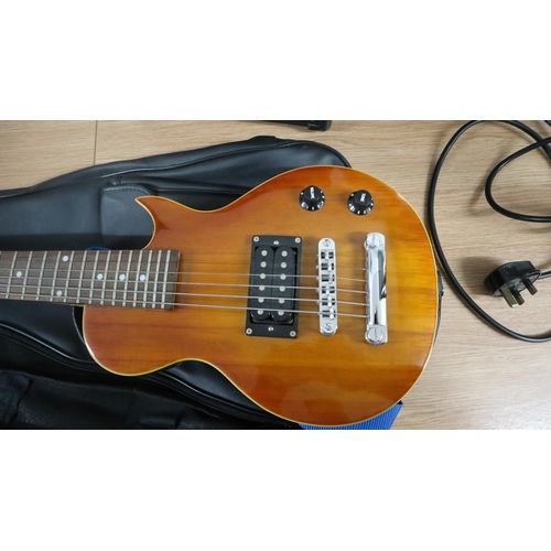 437 - Small electric guitar together with an Acoustic Solutions amplifier