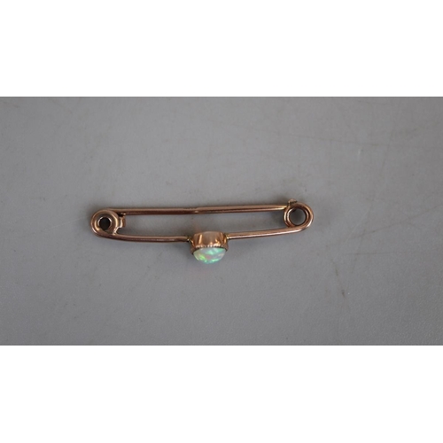 53 - Gold and opal bar brooch