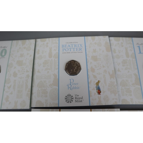 87 - Celebrating Beatrix Potter - Set of 5 50p brilliant & uncirculated coins plus another