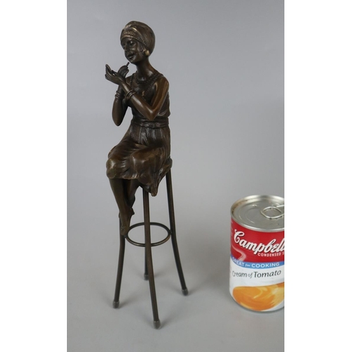 131 - Bronze figure of lady on stool - Approx height: 27cm