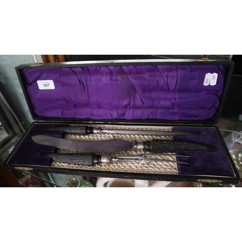 167 - Cased carving set with horn handles and silver collars