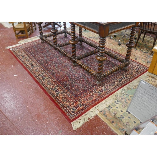 339 - Red and blue patterned rug - Approx size: 170cm x 252cm