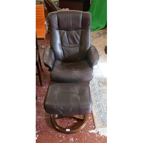 391 - Stressless style brown leather reclining swivel armchair together with matching foot stool