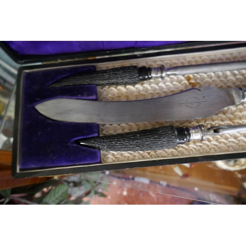 167 - Cased carving set with horn handles and silver collars