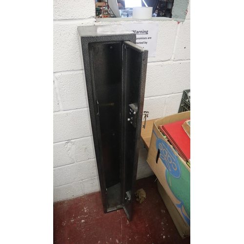 292 - Gun safe with key (holds about three rifles)