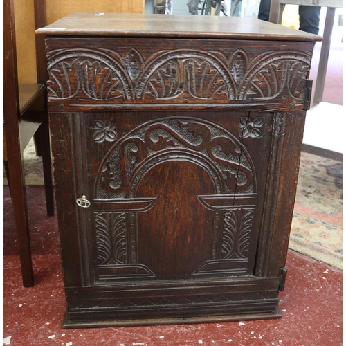 338 - Carved oak cabinet with its lock and key