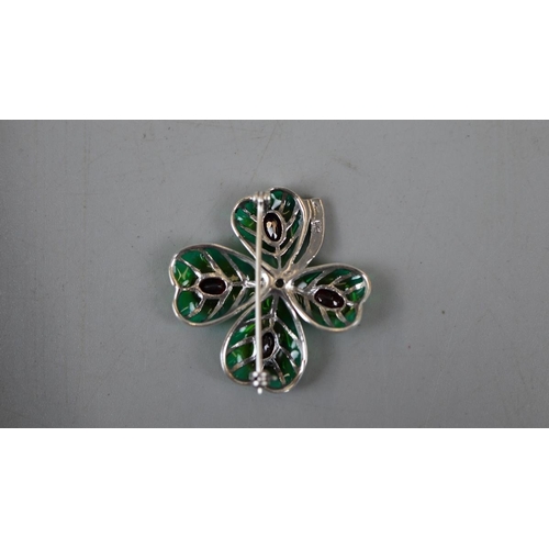 34 - Silver enamel and garnet clover brooch