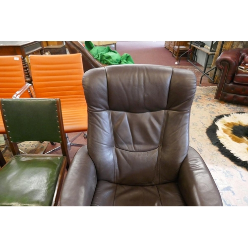 391 - Stressless style brown leather reclining swivel armchair together with matching foot stool