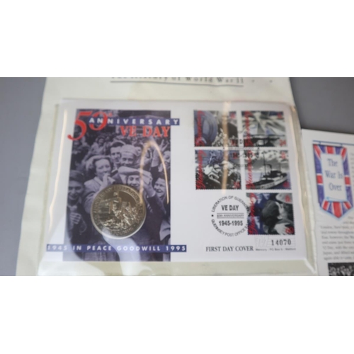 76 - World War II commemorative coins - VE day cover with £2 coin and 1st day cover stamps and furt... 