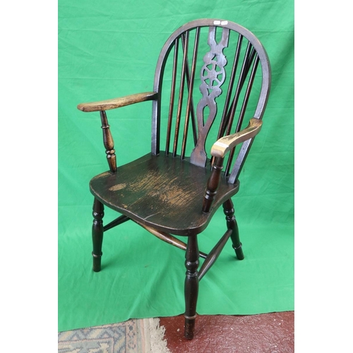 506 - Elm seated wheel back armchair 