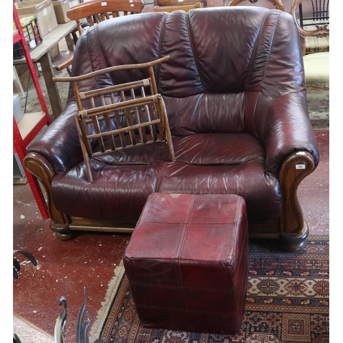 508 - Oak framed leather two seater sofa together with foot stool and bamboo magazine rack