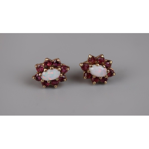 81 - Pair of gold opal and ruby earrings