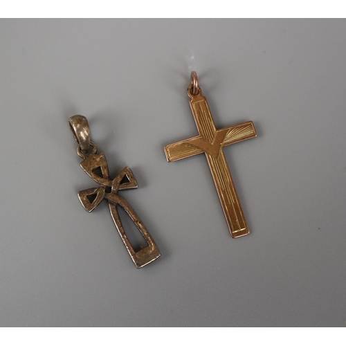 89 - Gold crucifix together with a silver crucifix