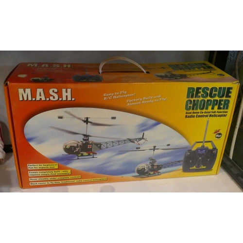 217 - Mash radio controlled helicopter together with an Action Man photo mission still in box