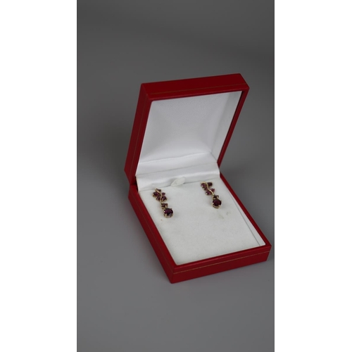 39 - Pair of gold stone set drop earrings