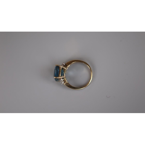 76 - Gold blue topaz and diamond ring - Size L