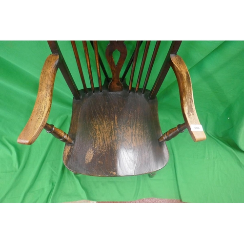 506 - Elm seated wheel back armchair 