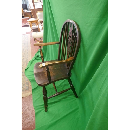 506 - Elm seated wheel back armchair 