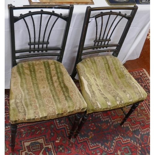 521 - Pair of ebonised chairs