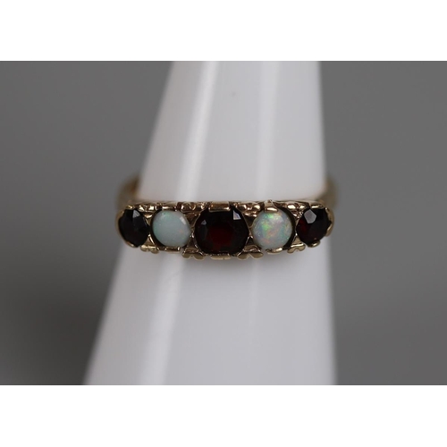 63 - Gold opal & garnet set ring - Approx size: M