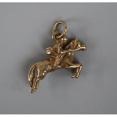 69 - Gold charm horse with rider