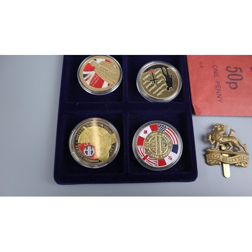 121 - WWII commemorative coins to include Royal Berkshire cap badge