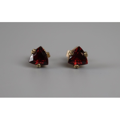 28 - Pair of gold garnet set earrings