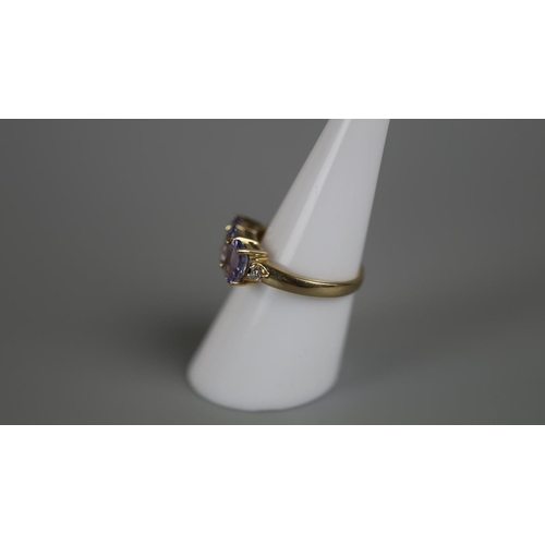 29 - Gold tanzanite & diamond set ring - Approx size: N