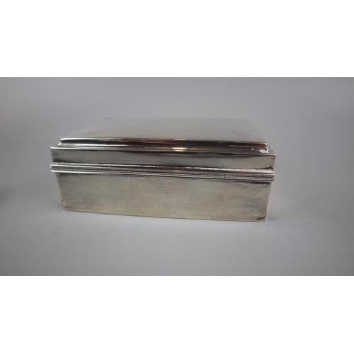 3 - Hallmarked silver cigarette box together with silver napkin rings