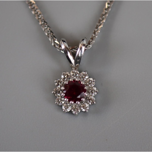 34 - White gold ruby and diamond set necklace