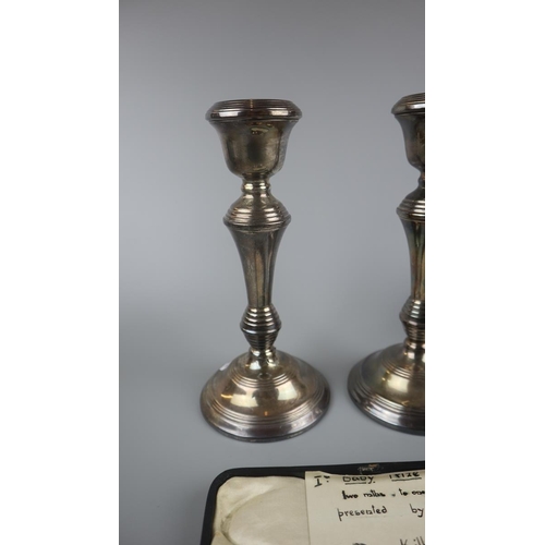 4 - Pair of hallmarked silver candlesticks together with hallmarked silver spoon