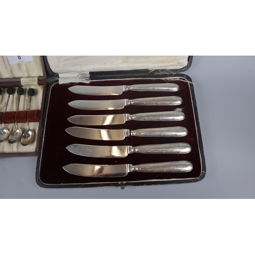 8 - Cased set of 7 hallmarked silver spoons together with a cased set of silver handles knives