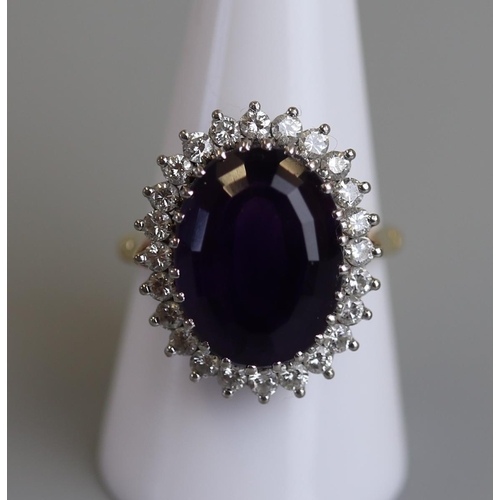 114 - 18ct gold Amethyst & diamond set ring