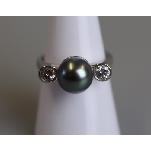 120 - 18ct white gold, large black pearl & diamond set ring - Size N