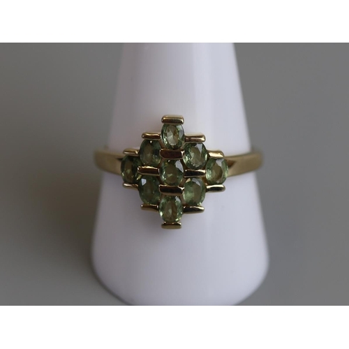 127 - Gold peridot set ring - Size T