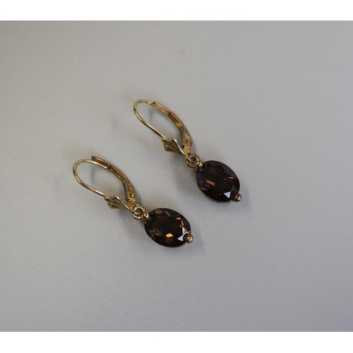 129 - Pair of gold topaz drop earrings