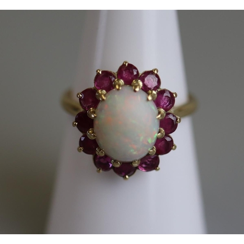 130 - 18ct gold opal & ruby set ring - Size M½