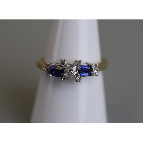 205 - 18ct gold diamond & sapphire set ring - Size O